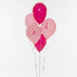 Bunch of pink balloons with breast cancer awareness ribbons on a white background
